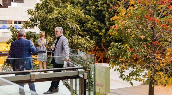 People at an event on Queensland Terrace.