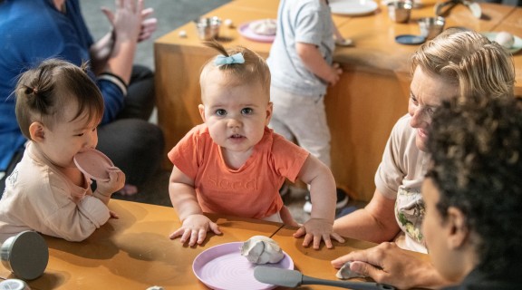 Babies playing with clay