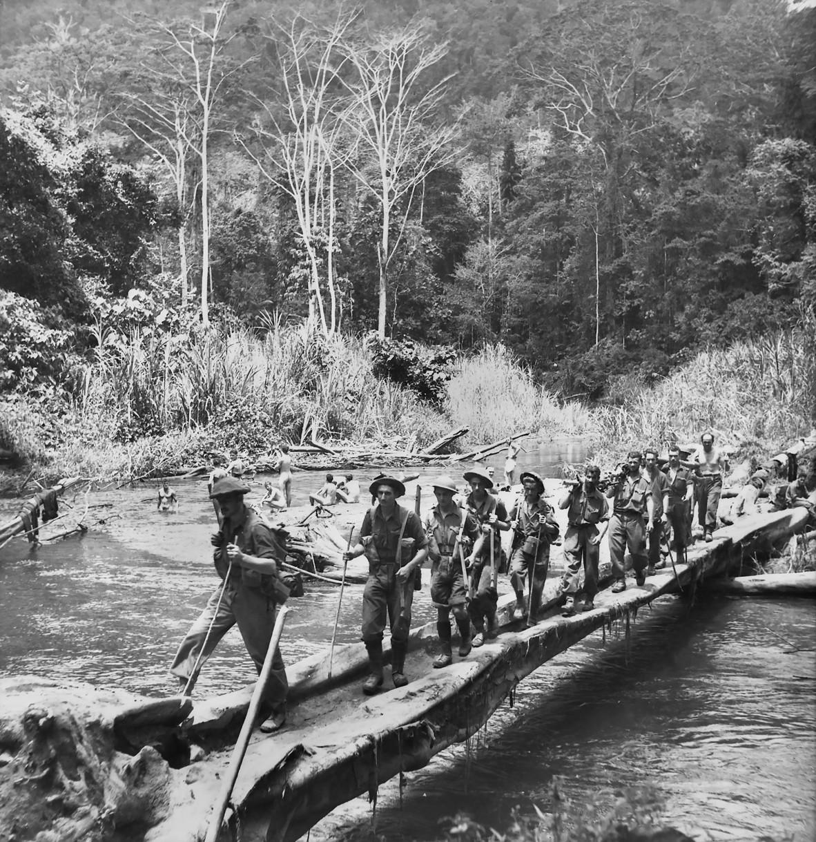 A group of troops crossing a river