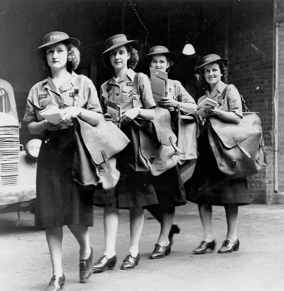 4 postwomen with their mail bags and bundles of mail Brisbane February 1943