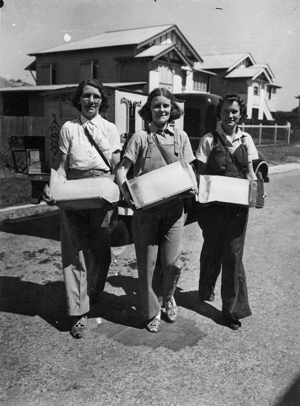 3 women selling ice in the suburbs Brisbane 1942 standing in front of cart and house