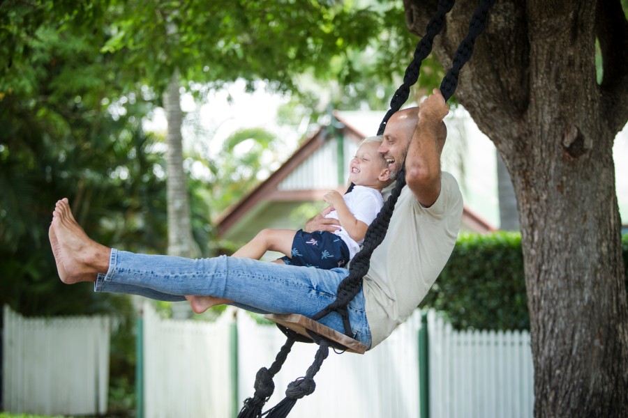 Father and son on swing