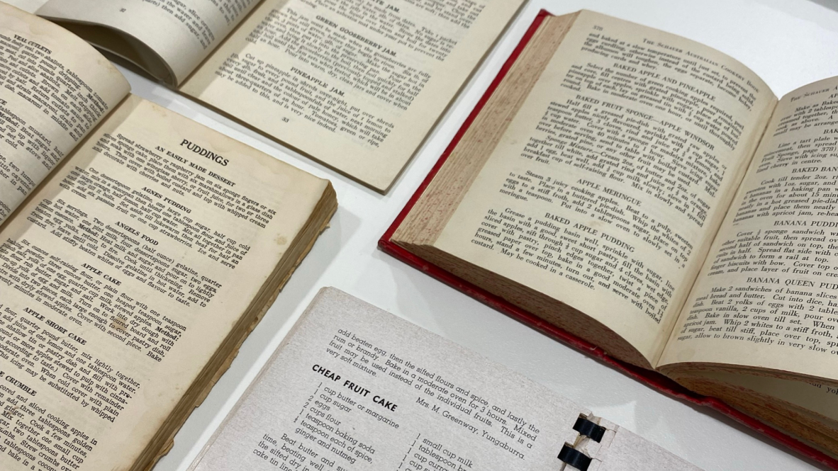 Arrangement of open recipe books from our collection, depicting recipes for various festive foods.