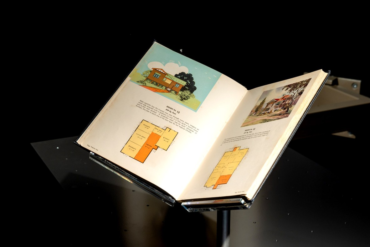 Open book showing house designs 