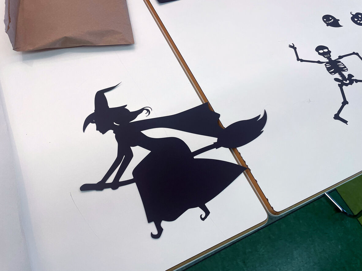 A photo of a carboard cut-out of a witch 