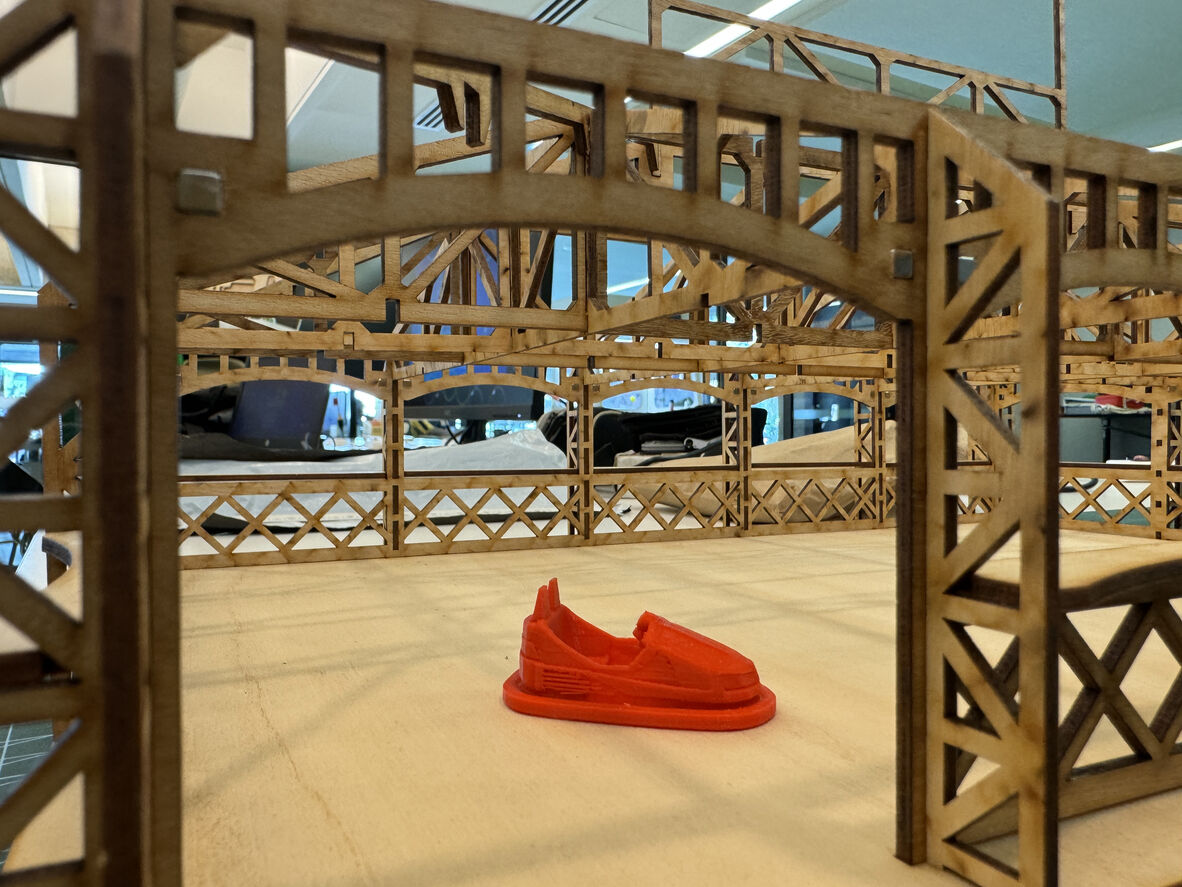 A photo of a miniature dodgem car replica being created