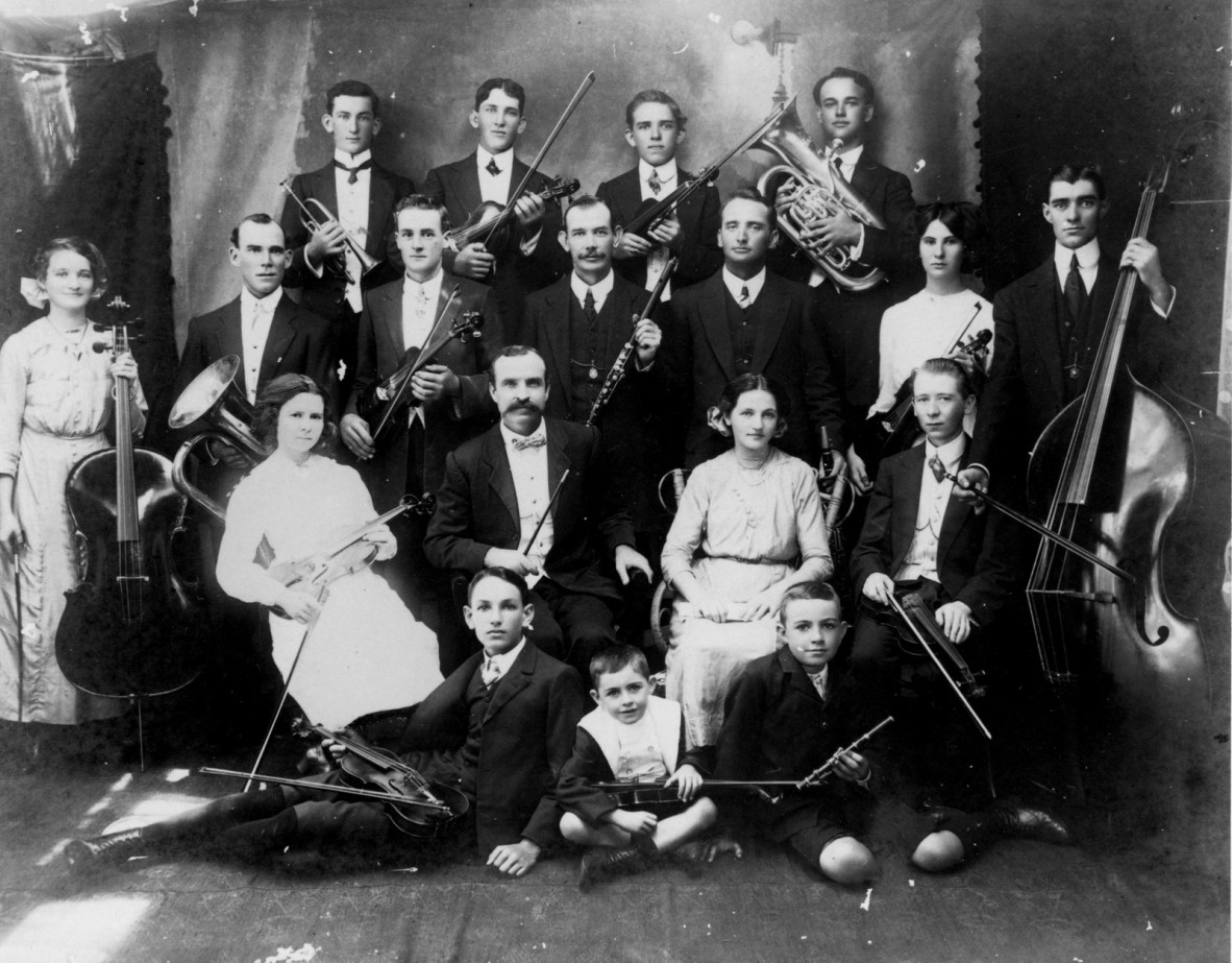 Image of orchestra members with instruments