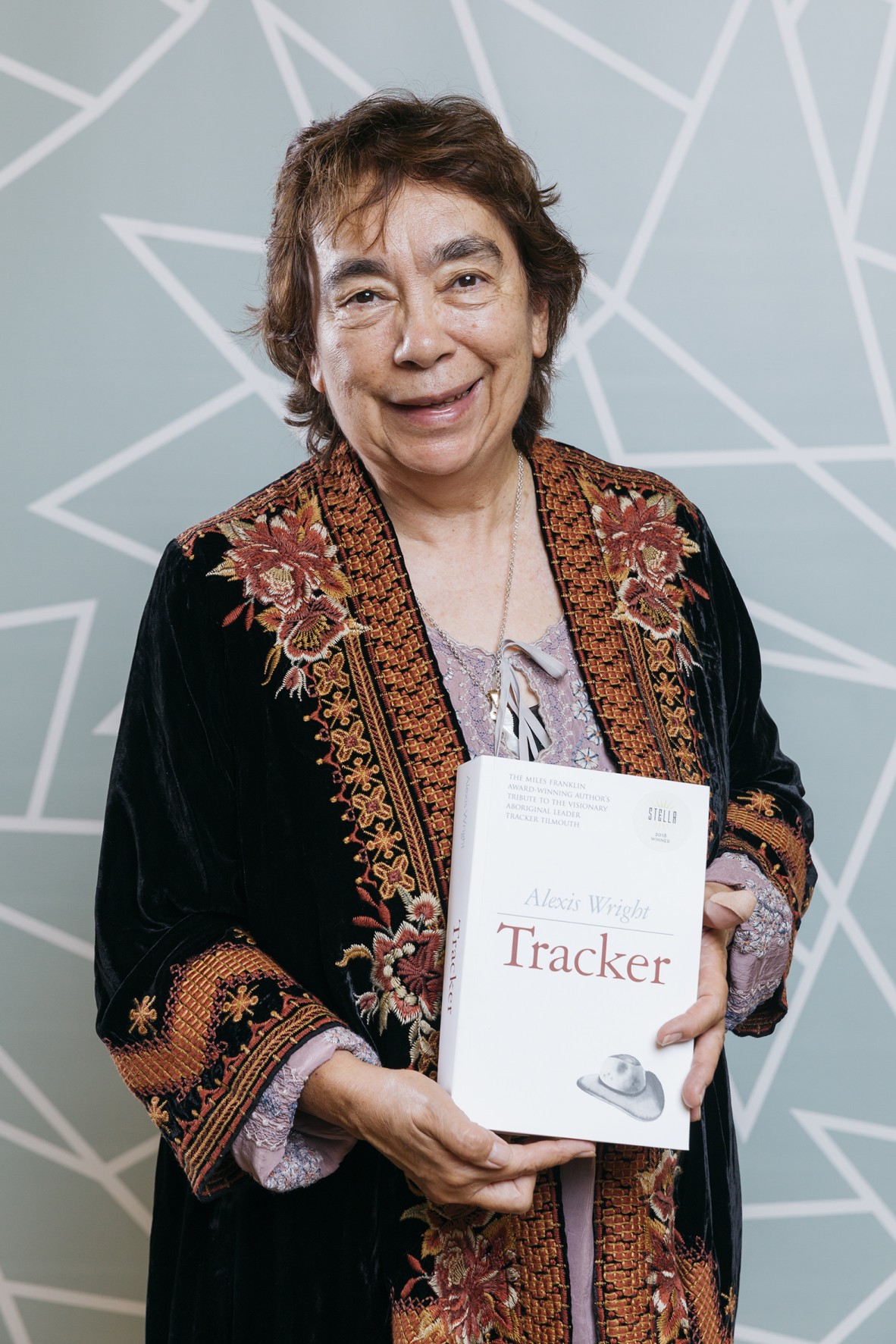 Alexis Wright holding her book 'Tracker' 