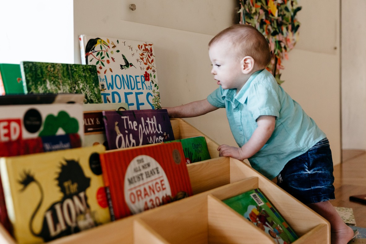 Little boy selecting his favourite book 
