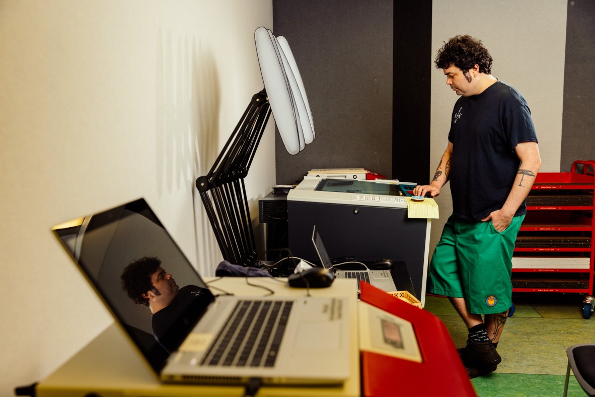 Josh uses the laser cutter