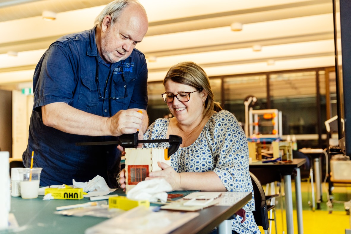 A couple making miniature book nooks at The Edge