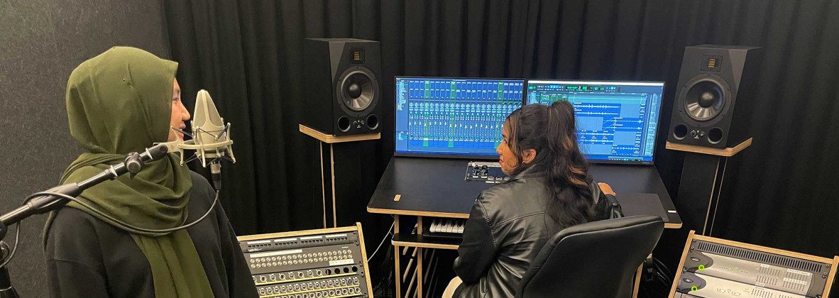 Two people in the recording studio