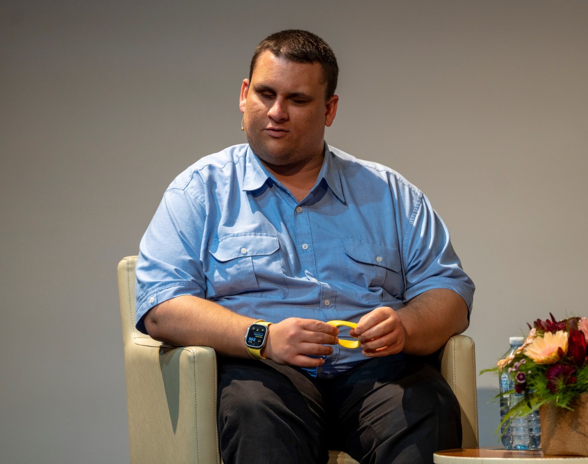 Brendon Donohue wears a blue button up shirt