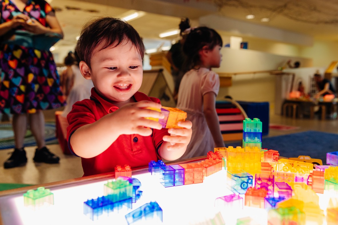 Little toddler playing with toys