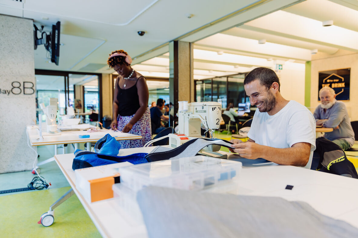 A photo of several people sewing at The Edge
