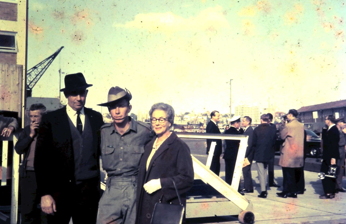 Joe and his parents on the dock awaiting departure. Joe is twenty years old. 