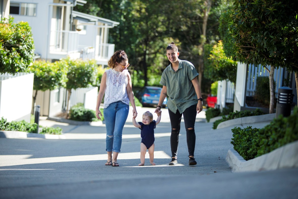 Family walking with baby outside