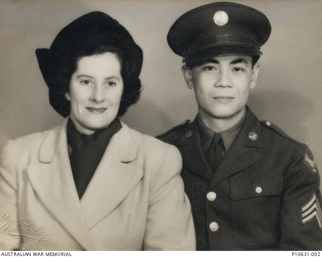 Studio portrait of Sergeant Francisco J Salveron, United States Army, and his Australian de facto wife Clarissa Gray (nee Willmett).