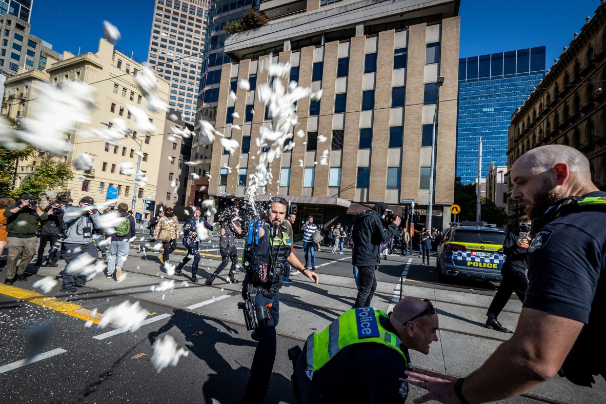 A photo of police using pepper spray on neo-Nazis