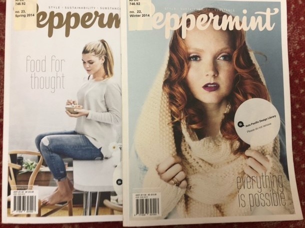 Photos of the cover of two Peppermint magazines one showing a woman on a stool looking at a small bowl in her hand the other a woman looking at camera wearing a knitted hooded cream jumper