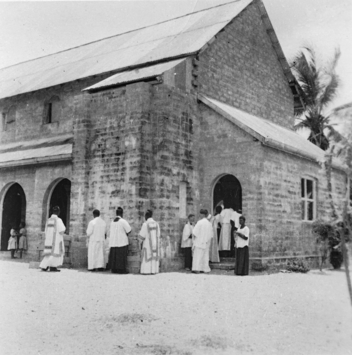 Anglican clergy outside a church in the Torres Strait, 1954.