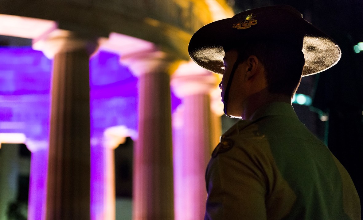 A Young soldier standing during the Anzac Day dawn service in Brisbane, Queensland, 2014
