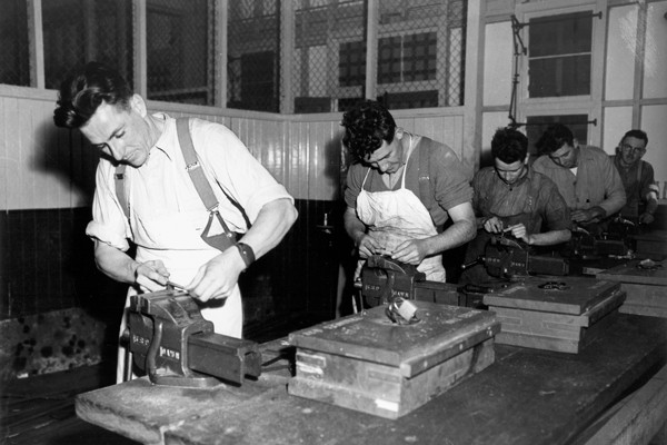 Army personnel undergoing workshop training in a mechanical workroom