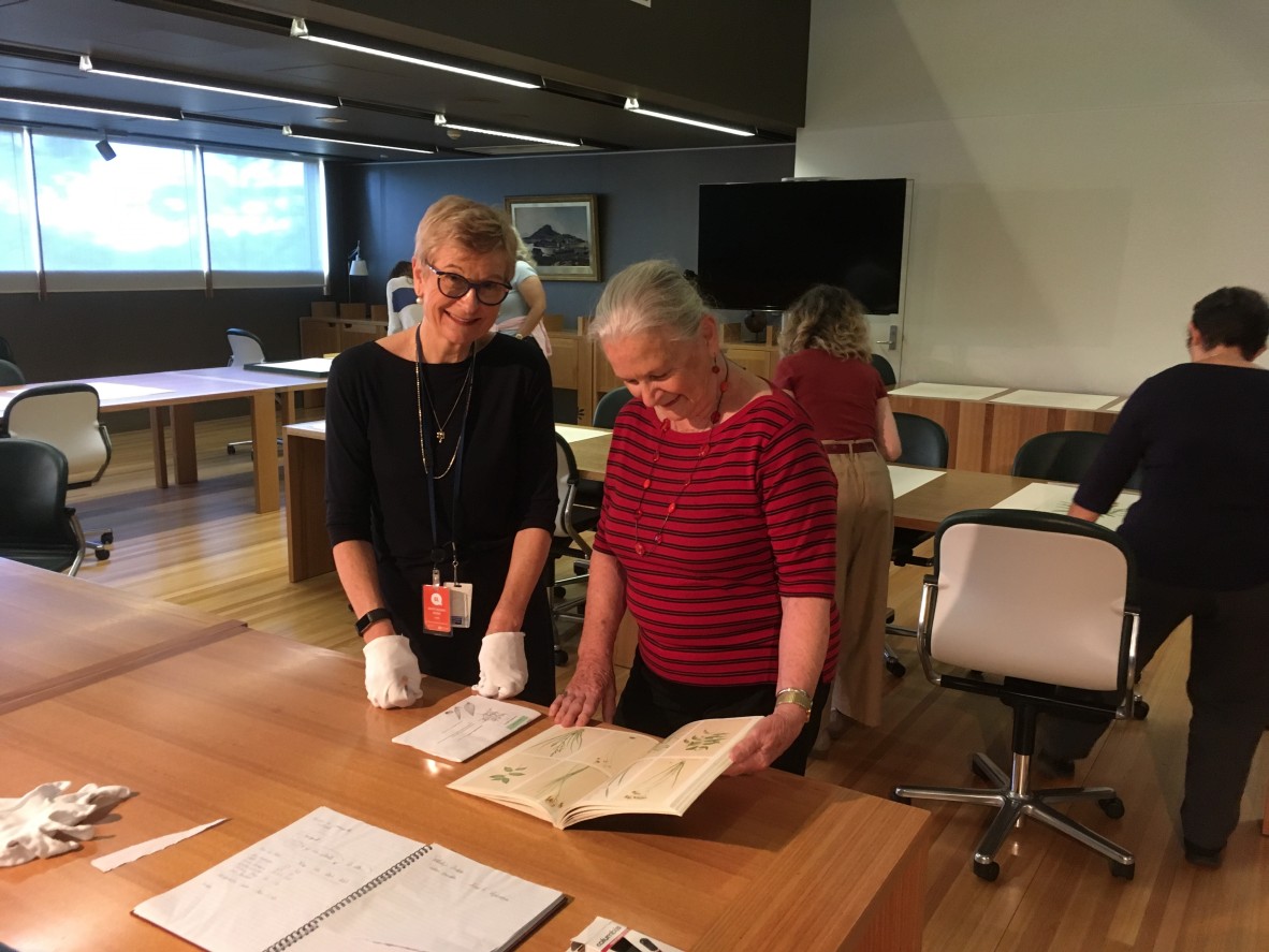 Specialist Librarian Christene Drewe with artist Kay Sullivan and other artists at the State Library of Queensland.