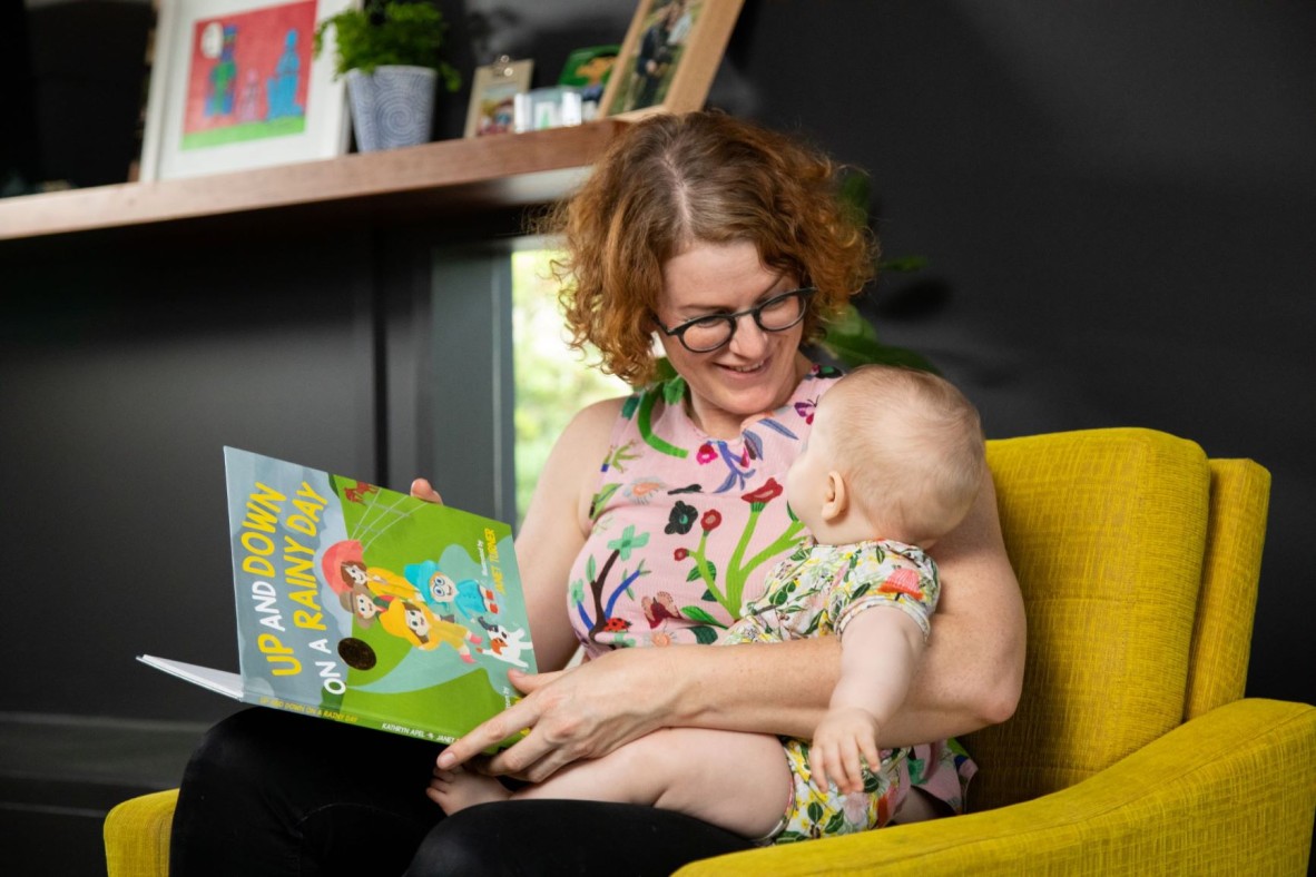 Mother reading to baby