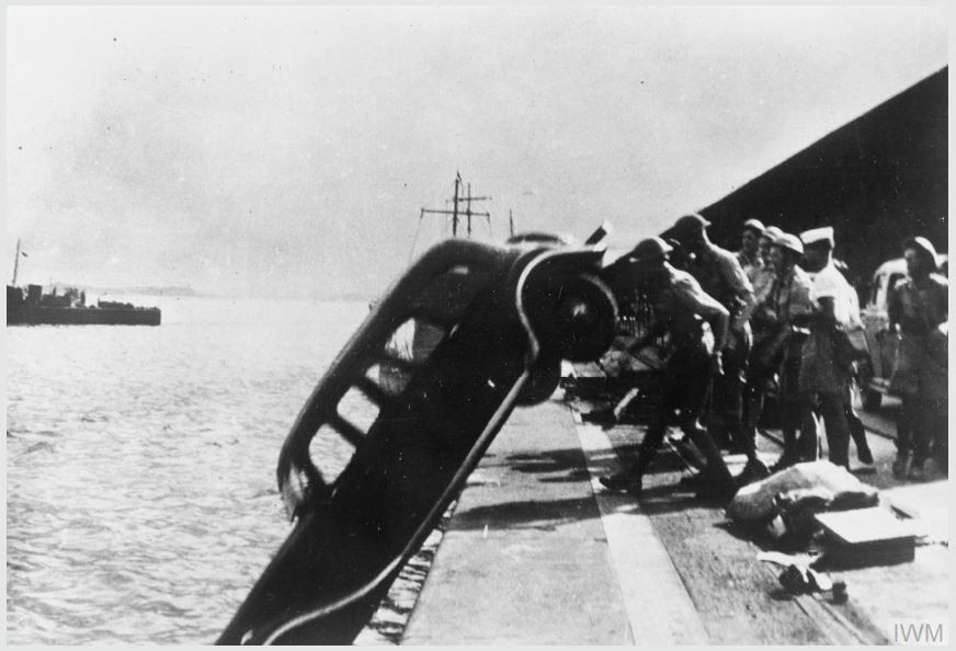 Soldiers push car into water in singapore, 1942