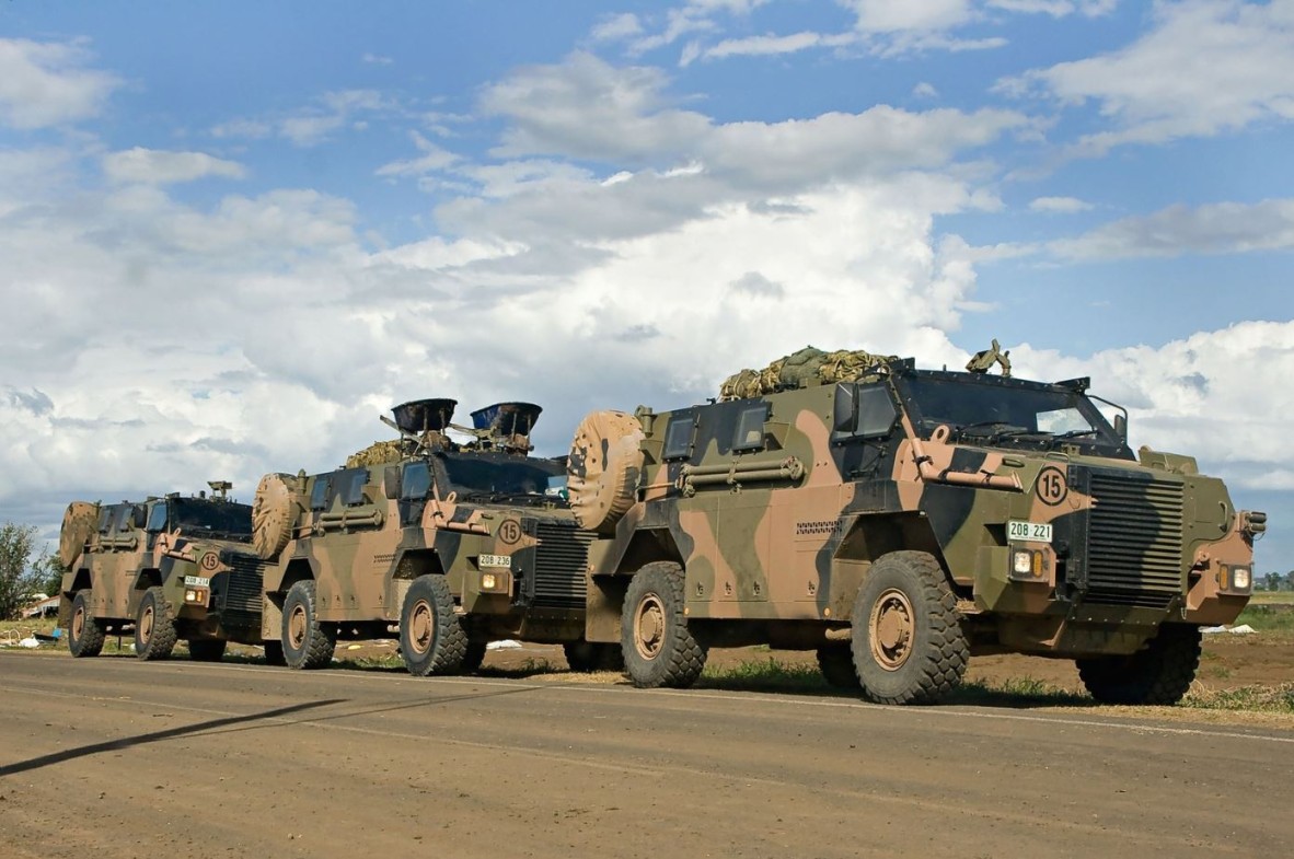 Photo of three Australian Army bushmaster vehicles in convoy