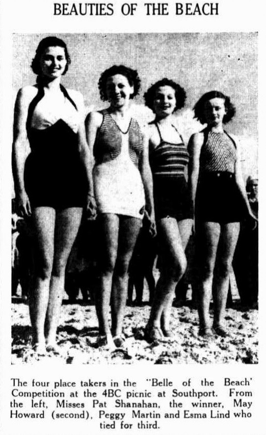 Photo of four women posing in bathing suits at the beach in 1936