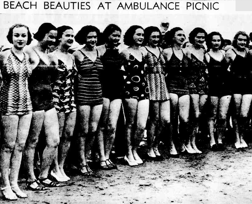 Photo of eleven women in bathing costumes lined up in a beauty competition on the beach
