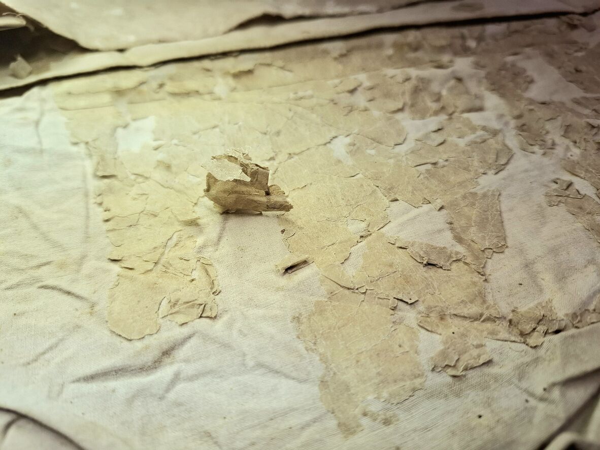 Paper separating from the textile backing