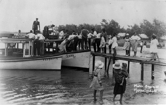 Black and white image of a group of people getting on board the 'Favourite' and the 'Vera' motor boats at Maroochydore, ca.1918.