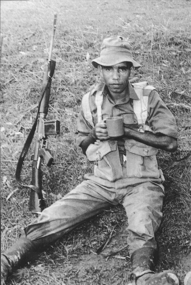 Aboriginal Soldier Claude Malone resting while on patrol in Vietnam War