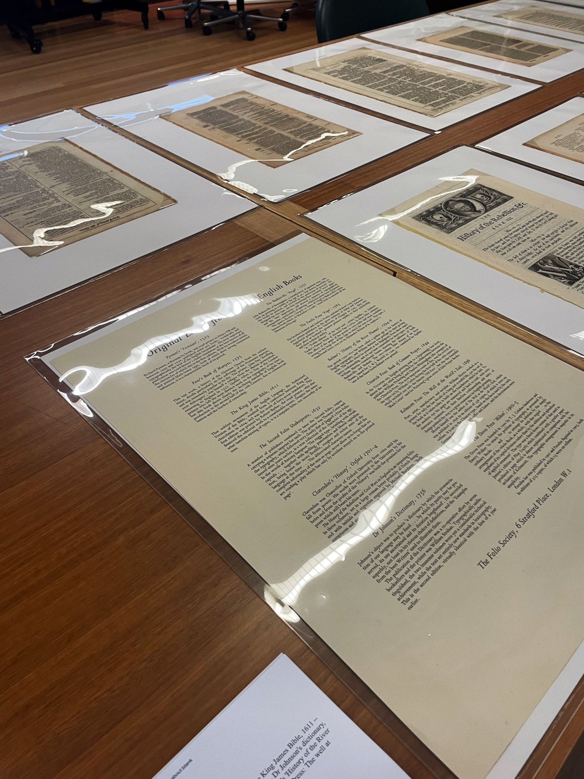 A collection of pieces of papers from different books all covered for protection