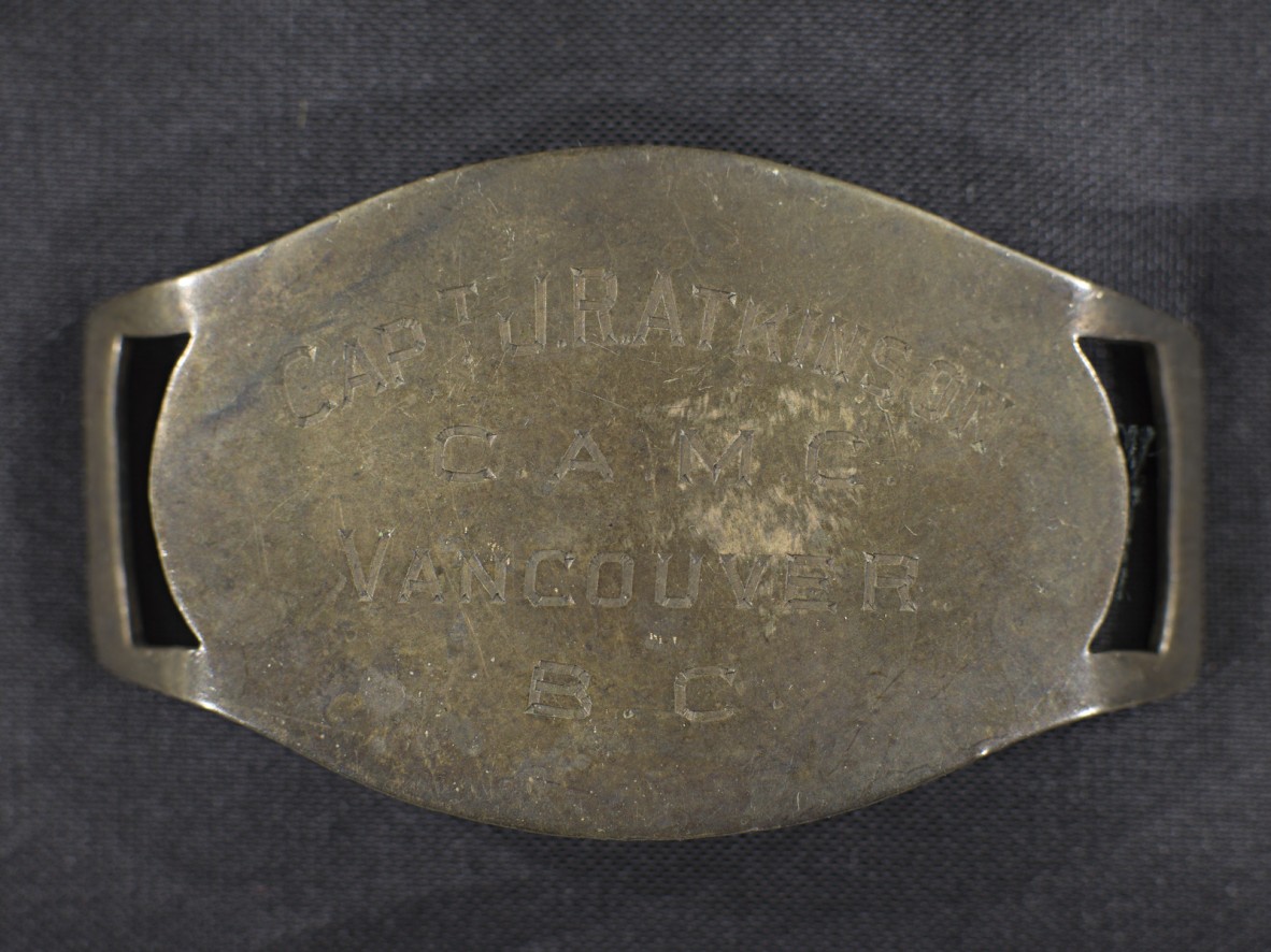 An identity bracelet that reads 'CAPT J.R.ATKINSON C.A.M.C. VANCOUVER B.C.'