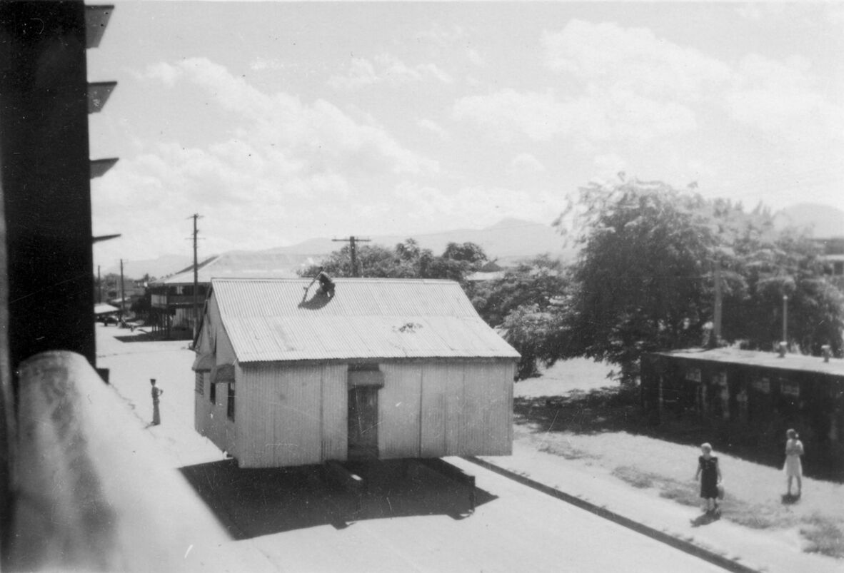 Corrugated iron worker's cottage is being relocated down Norman Street, Gordonvale, c.a. 1948.