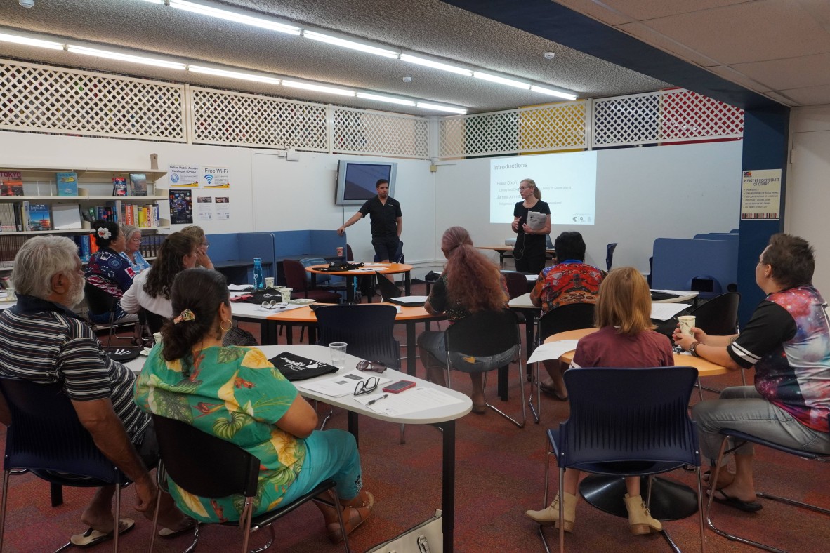 Photo of people at Mt Isa City Library watching presentation