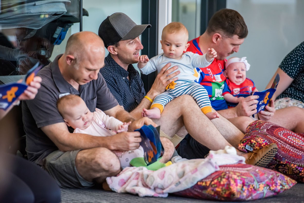 Fathers and babies attending a baby play session