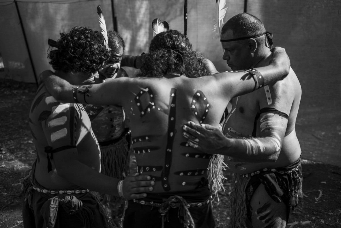 Deaf Indigenous Dance Group dancers huddle at the Laura Quinkan Dance Festival, July 2021.