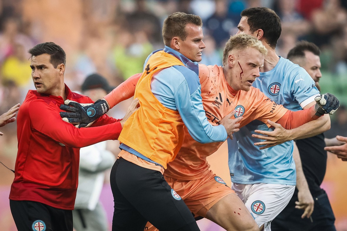 A photo of footballers in a scuffle