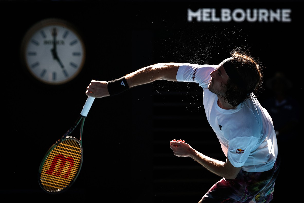 A photo of a tennis player mid serve