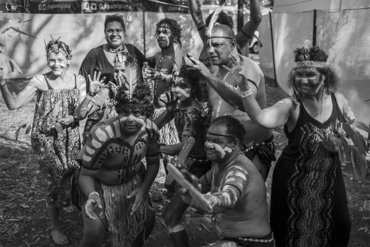 Deaf Indigenous Dance Group dancers at the Laura Quinkan Dance Festival, 2021. The dancers are posing as a group and wearing straw skirts and body paint.