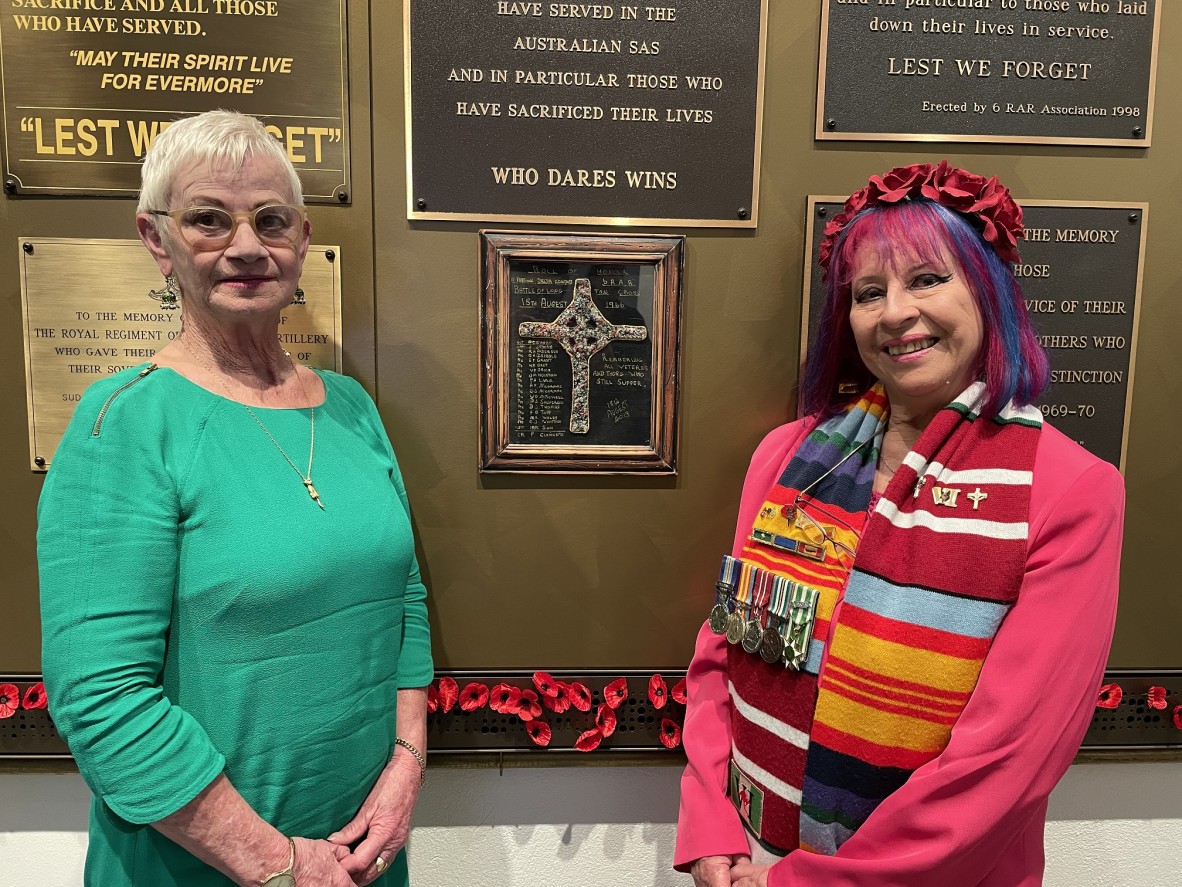 Diane Dickson (left), the creator of the Long Tan Cross plaque, with friend Frankie O’Leary (right) standing by the plaque. 