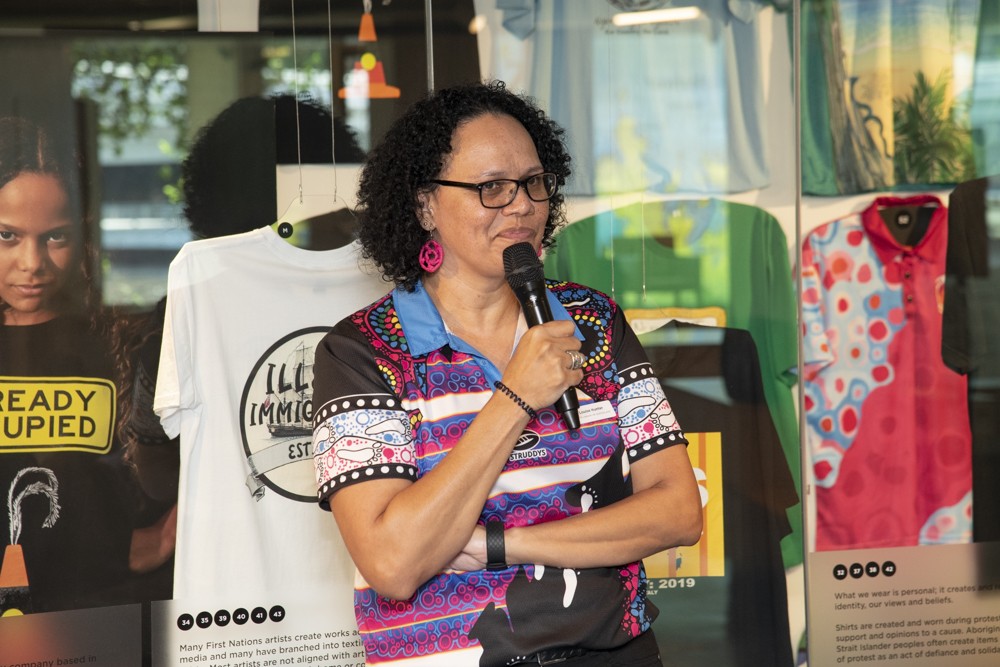 Louise Hunter, Deadly Threads curator giving exhibition tour