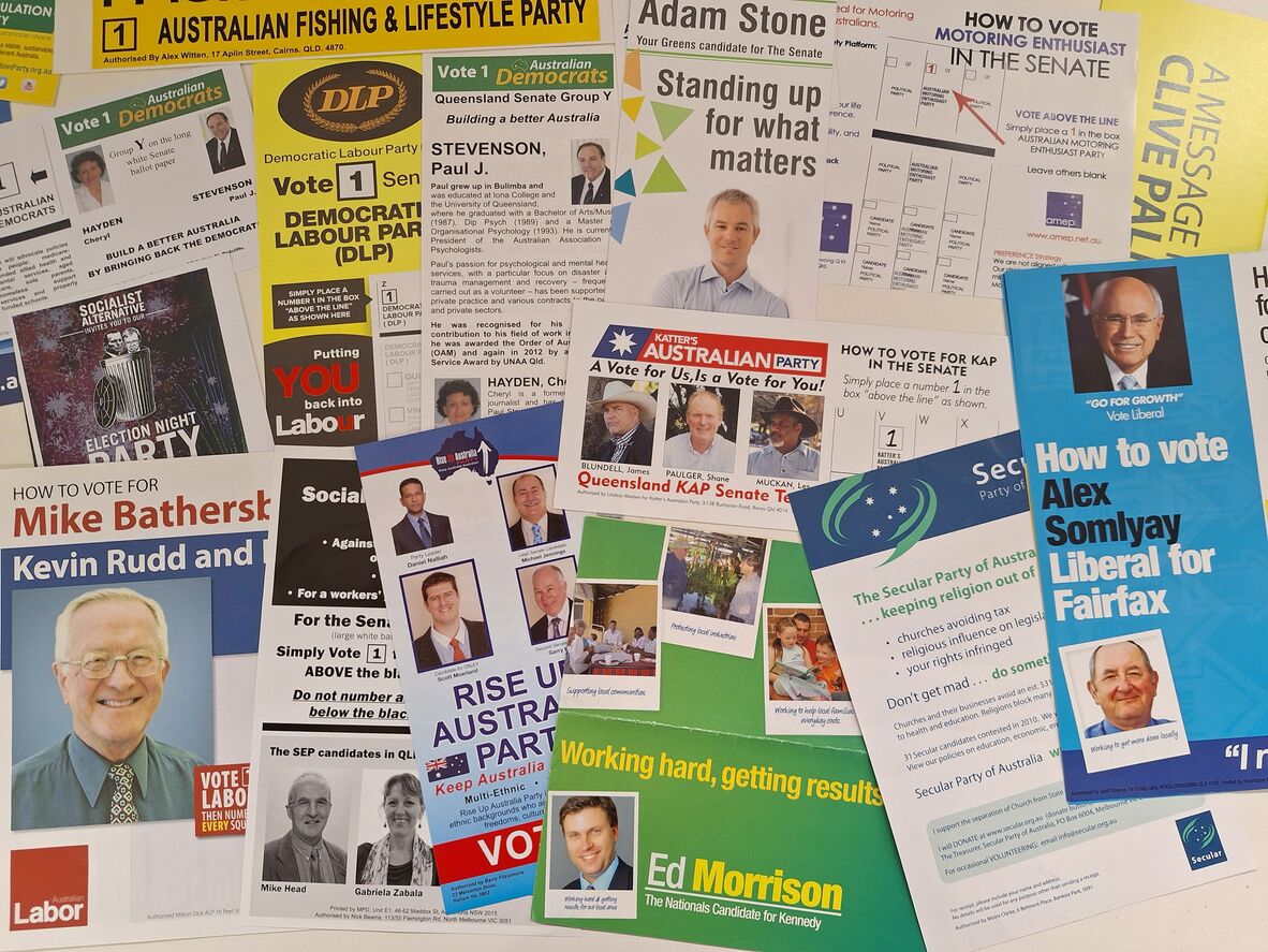 A selection of election leaflets scattered across a table