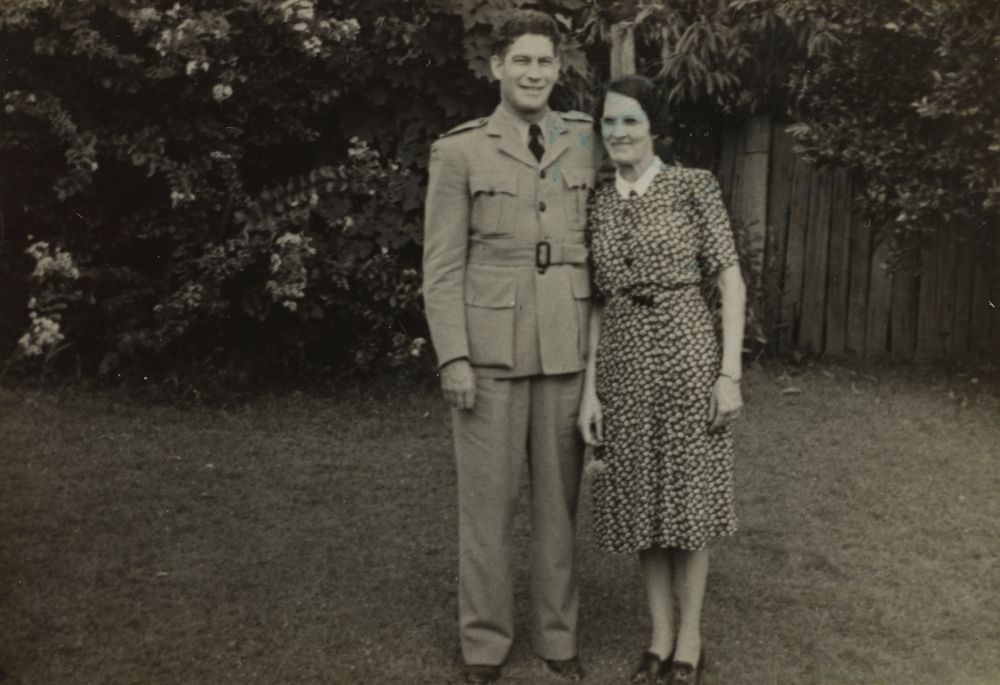 Ernest Duncan in his RAAF uniform standing with a woman.