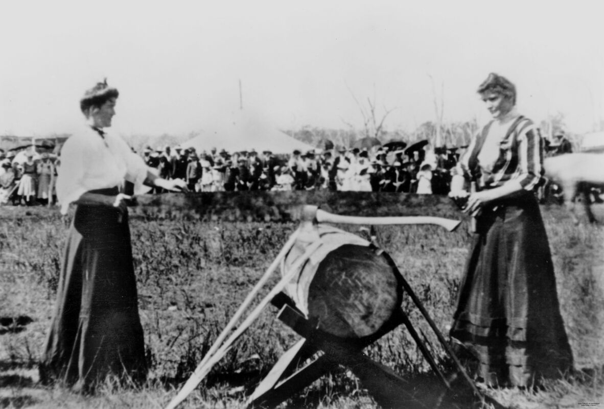 Lynch sisters demonstrating their wood sawing skills at the Kingaroy Show, Queensland, 1909.